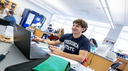 Fredonia student in the bio genetics lab