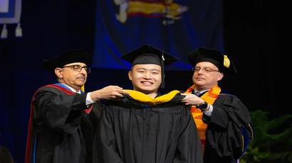 graduate student at commencement ceremony