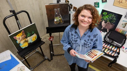 Fredonia student in a paingint studio. Students at Fredonia have the chance to earn degrees in 65+ different programs leading to great careers and enriched experiences. 