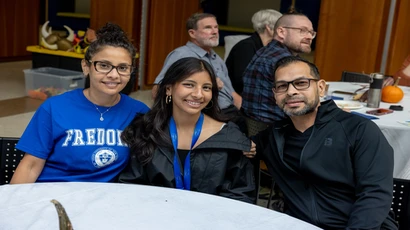 A Fredonia student and her family during the Friends and Family Weekend event