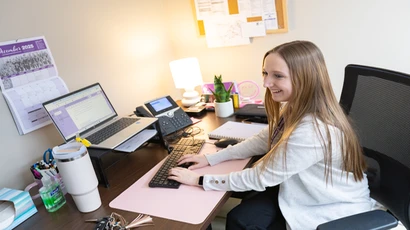 Psychology alum working in her office