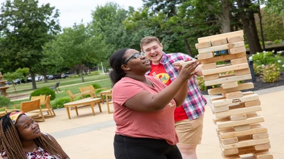 Fredonia students playing patio games 