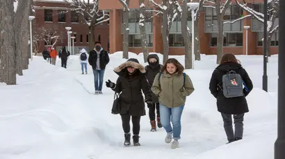 Fredonia students enjoying a brisk winter day while walking across campus