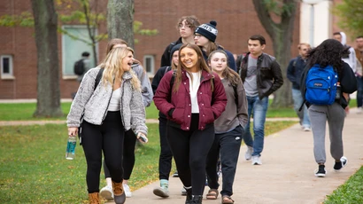 Fredonia students walking on campus. Fredonia's welcoming environment is perfect for transfer students, supporting them with making their transition to a new environment easier.