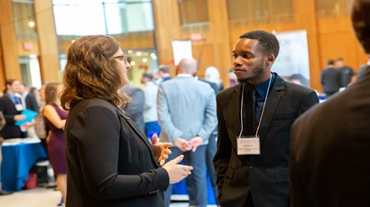 Employer and student in conversation at job fair
