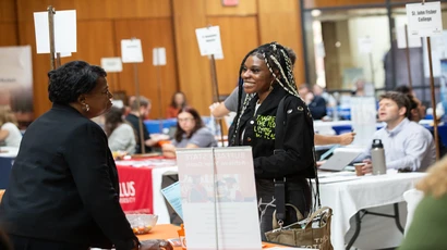 Student networking with employer