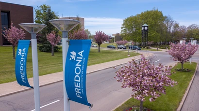 View looking into campus from a main entrance. Fredonia graduate students come from across the world and enjoy some of the lowest tuition in the nation.  