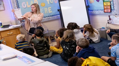 A SUNY Fredonia teacher candidate working with her elementary students.