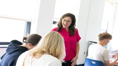 Katie Miley, a student in the Graduate Education Literacy program, works with high school students at Southwestern.