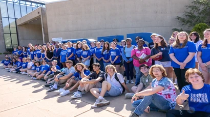 Image of Incoming Honors class of 2029 posing in front of FRED sign with President Kolison