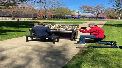 TV camerman shooting video on campus