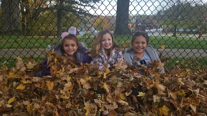 After school program playing in the leaves