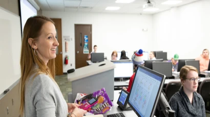 Mathematics professor Amber Powell outlines an exercise in a statistics class.