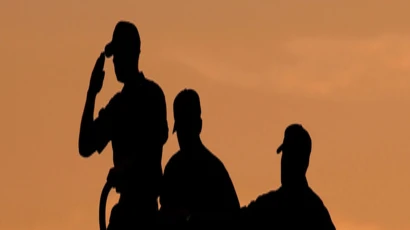 sailors salute on a ship