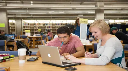 tutor working with student in the center