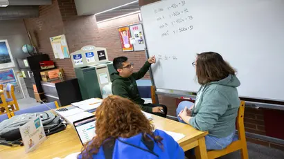 tutor working with students