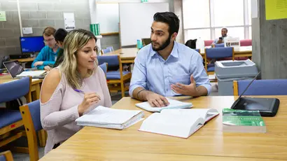 tutor working with student in the center