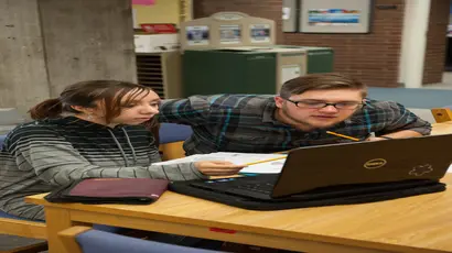student working with tutor in the center