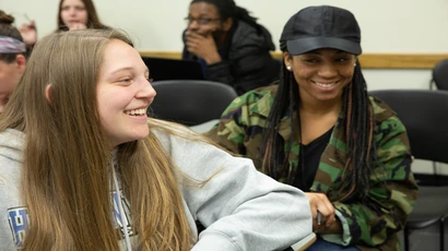 Students engage in lively discussion during Communications class; communication studies major, communication studies degree