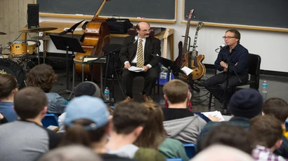 A guest speaker addresses music industry students during class where students learn about the music business degree,  music industry, music industry majors, and the degree in music business