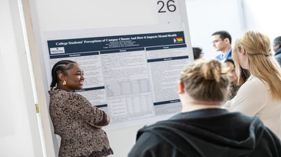 Student presenting on a healthcare topic at a conference