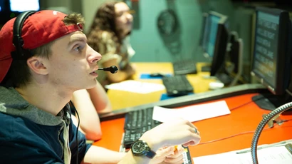 a student directs a production in the Thompson TV studio. degree in video production, video production degree, major in video production. 