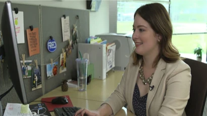 Fredonia alum Lauren Orlowski works on her job in her office. public relations major, major in public relations, degree in public relations.