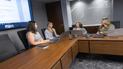 accountants talk in a conference room