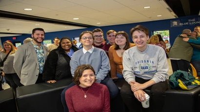 alumni gather for a photo