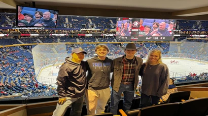sport management students pose at buffalo sabres hockey game
