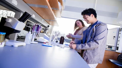 professor and student work in a biology lab