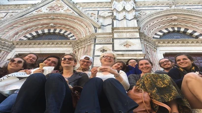 Study abroad students pose for a picture outside a gallery in Italy for a major in art history degree. bachelor art history.