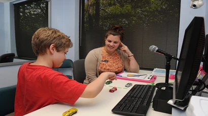 Speech pathologist with client