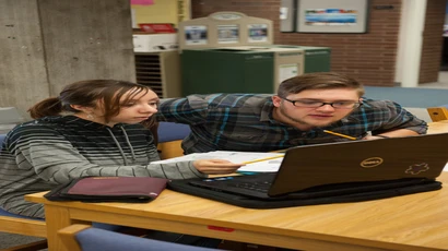 Tutor working with student