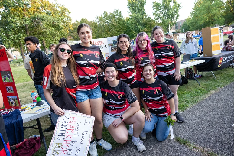photo of women's rugby team in uniform at Activities Night