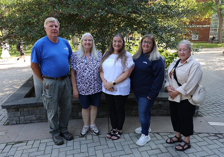 a photo of the five award winners outside