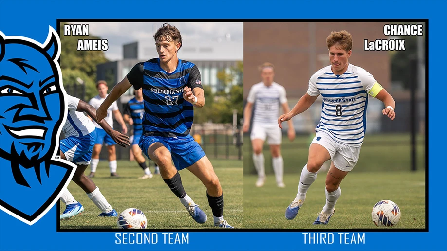 two soccer players in action on the field