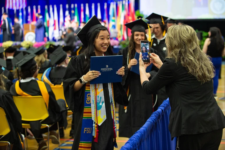 student celebrating with family