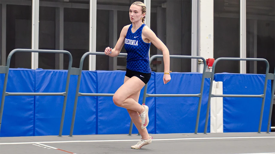 Emma Gassman running on the track