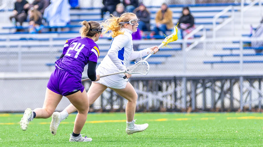 lacrosse players on the field