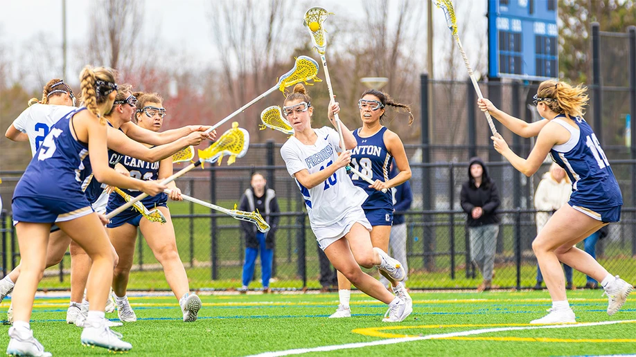 lacrosse players on the field