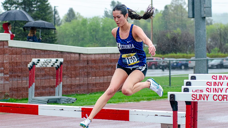 female athlete running the steeplechase