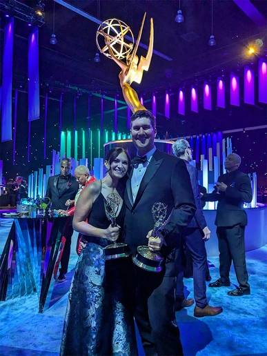 Steve Giammaria and Greta Boorn holding Emmy awards