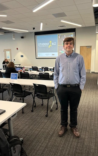 Zachary Dean standing in a classroom
