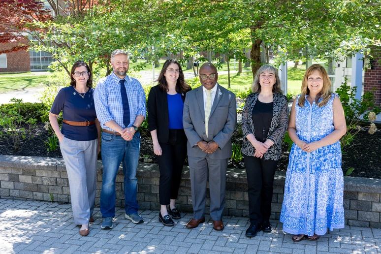 President Stephen H. Kolison Jr. (center) with SUNY Chancellor’s Award for Excellence recipients (from left): Erin Mroczka (Professional Service), Jason K. Bussman (Adjunct Teaching), Christina Hilburger (Librarianship), Dr. Reneta Barneva (Faculty Service) and Rhonda Gominiak (Classified Service).