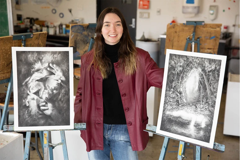 Emily Neiswonger, with two illustrations that were part of the 63rd annual Society of Illustrators competition in Los Angeles, CA.