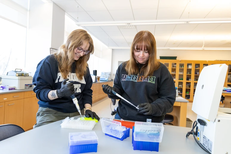 two students working in a lab