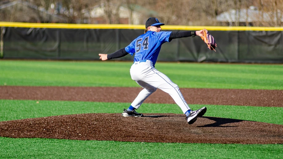 baseball pitcher in action on the pitching mound