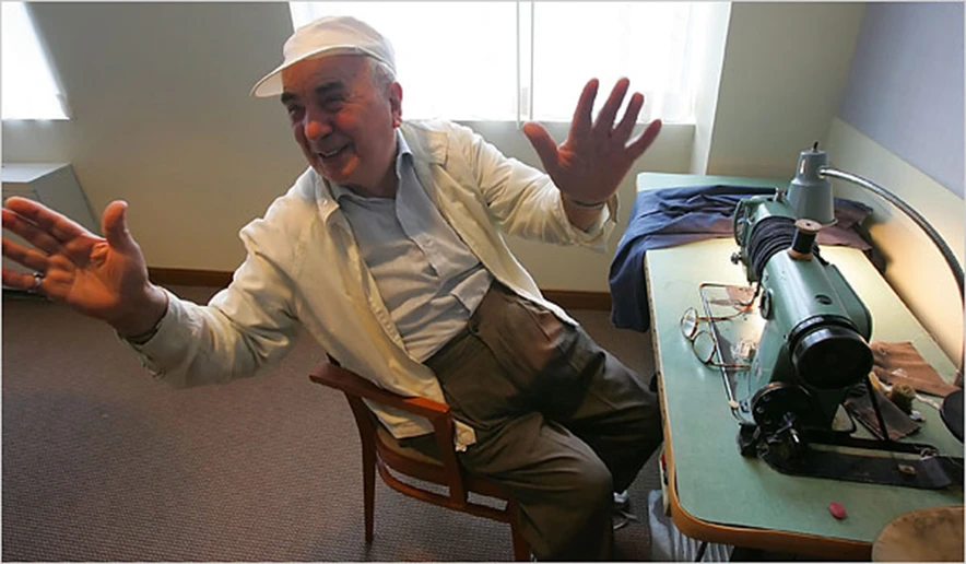 Bernard Adler at a sewing machine