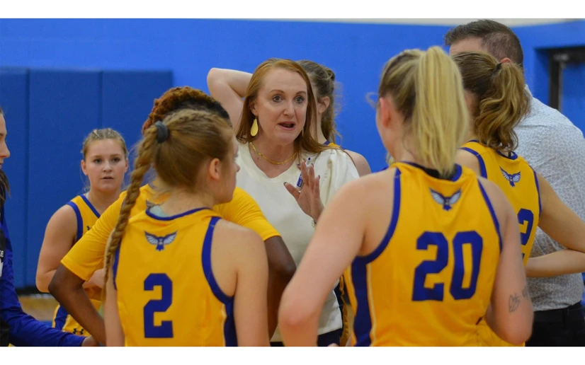 Coach Bullock with athletes on the court